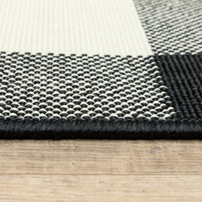 2' X 4' Black And Ivory Indoor Outdoor Area Rug