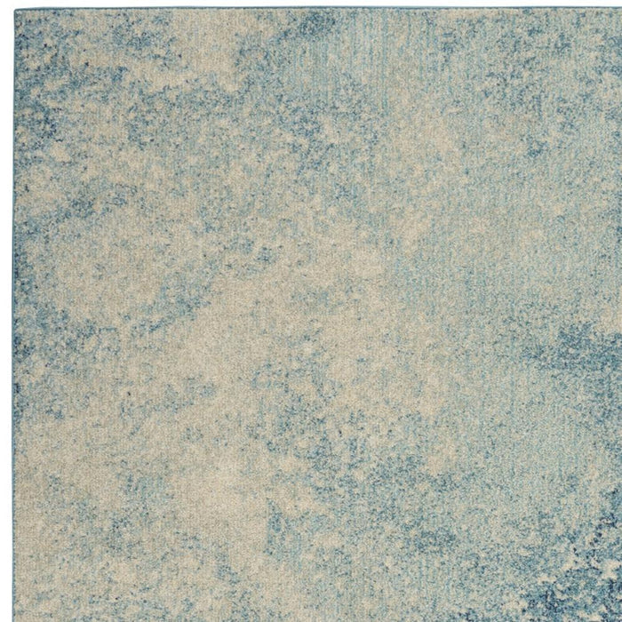 4' X 6' Blue And Ivory Abstract Area Rug