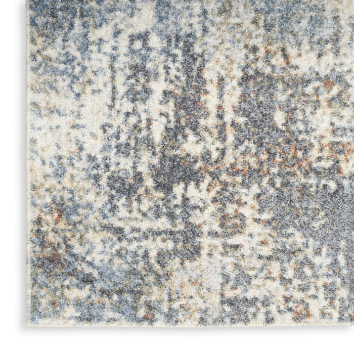 4' X 6' Blue and Ivory Abstract Power Loom Washable Area Rug