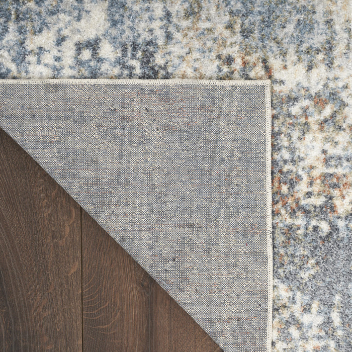 4' X 6' Blue and Ivory Abstract Power Loom Washable Area Rug