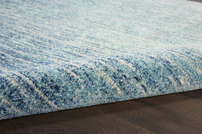 5' X 7' Blue And Ivory Abstract Area Rug