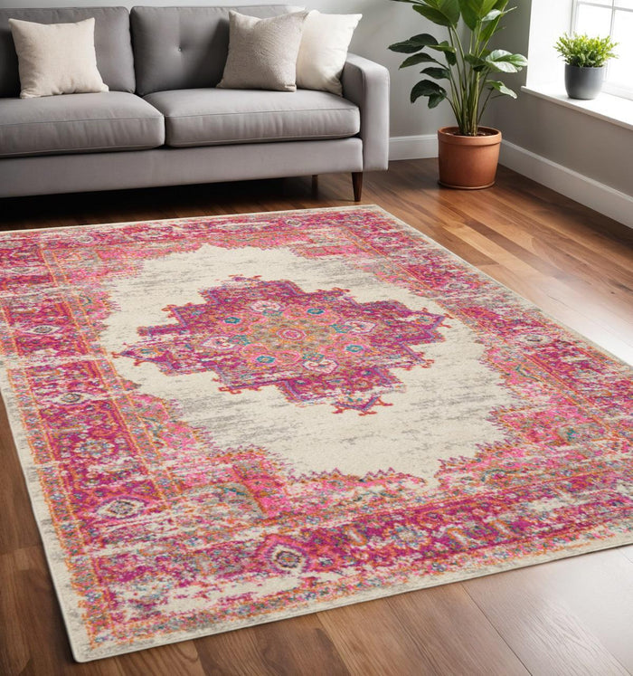 5' X 7' Ivory And Fuchsia Oriental Distressed Area Rug