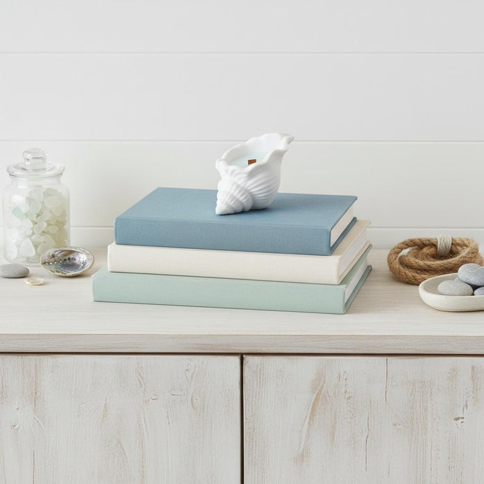 6" Light Blue Ocean Breeze Scented Soy Wax Candle In White Resin Novelty Holder