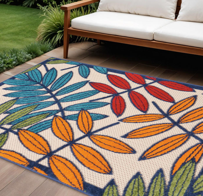 7' X 10' Ivory And Blue Floral Indoor Outdoor Area Rug