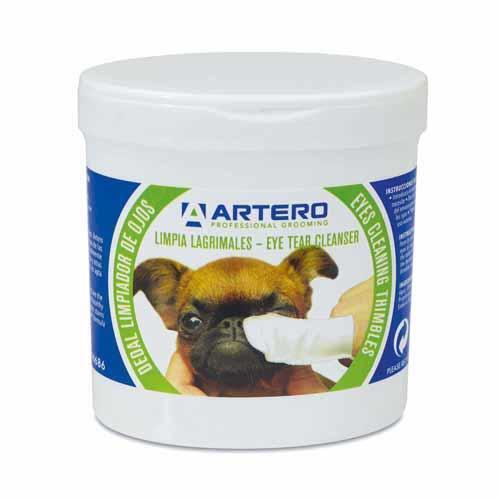 Tub of Artero disposable eye cleaning wipes being used on a dog's eye
