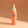 Orange bottle of INOOM vegan Pet Ear Cleaner with a nozzle cap