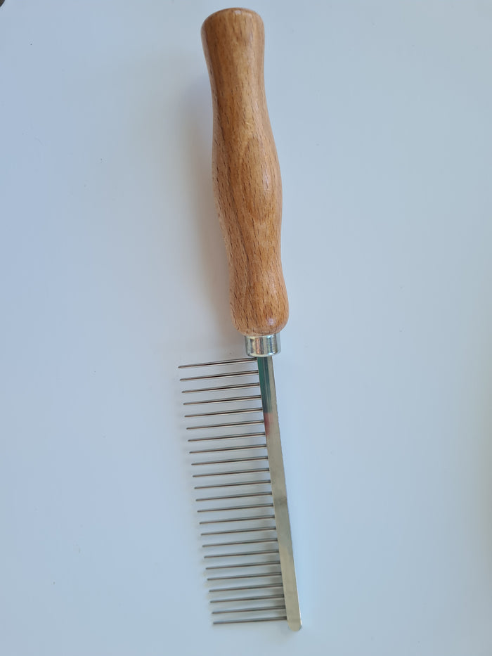 Large wooden-handled grooming comb with regular-spaced metal teeth