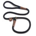 Black rope slip lead with brown leather stopper and ring, coiled on white background