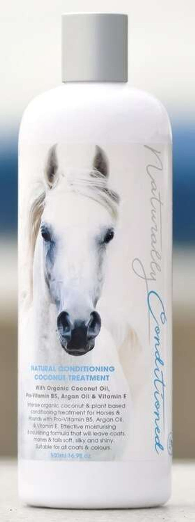 Bottle of Naturally Conditioned Coconut Treatment with white horse image on the label