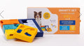 Pawzler Smarty Set box with dog beside disassembled yellow, teal and navy puzzle pieces