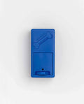 Closed blue Pawzler Onix puzzle piece with bone icon and sliding treat drawer, top-down view