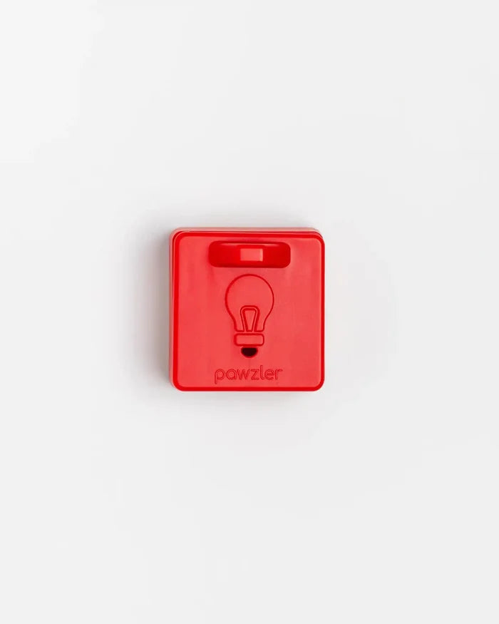 Closed red Pawzler Peach puzzle piece with lightbulb icon, top-down view