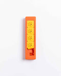 Closed orange Pawzler Zhu puzzle piece with four yellow flower-shaped tiles, top-down view