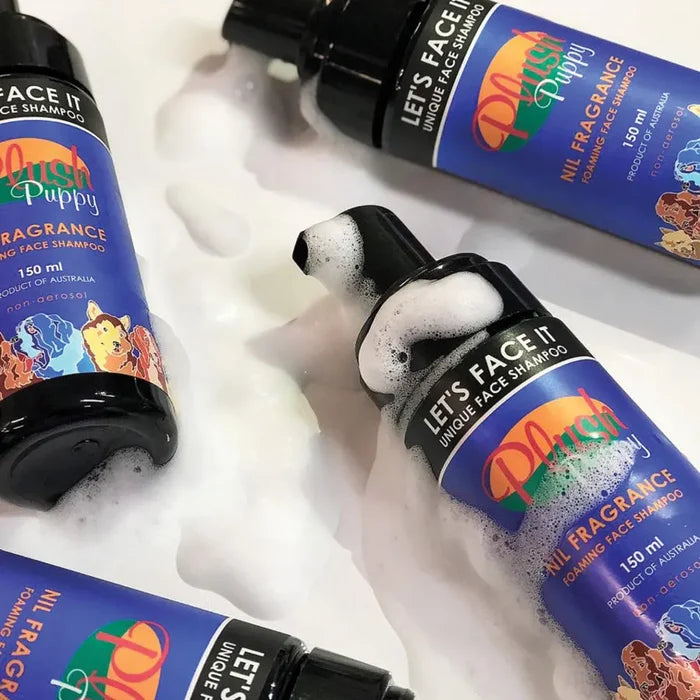 Several bottles of Plush Puppy Let's Face It facial cleanser surrounded by foam