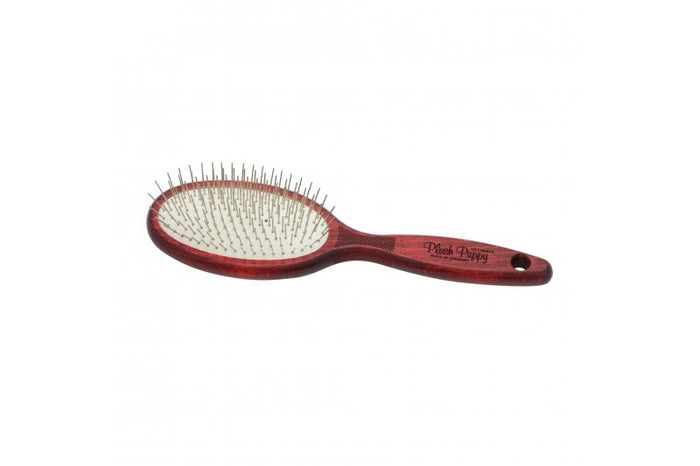 Plush Puppy Ultimate Pin Brush with red wooden oval head and ergonomic handle, angled view