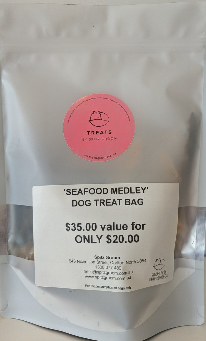 Silver Seafood Medley dog treat bag with Spitz Groom Treats sticker and price label