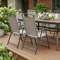 Set of Four 35" Brown Steel Sling Outdoor Folding Arm Chairs