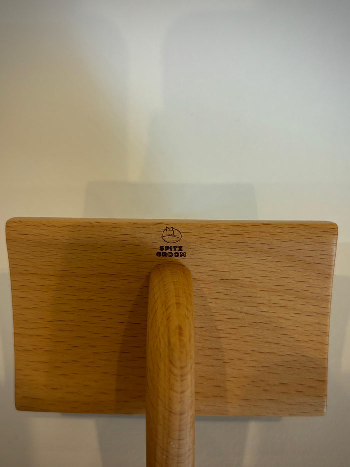 Close-up of the Spitz Groom logo branded on the wooden Extra Firm Medium Dog Slicker Brush