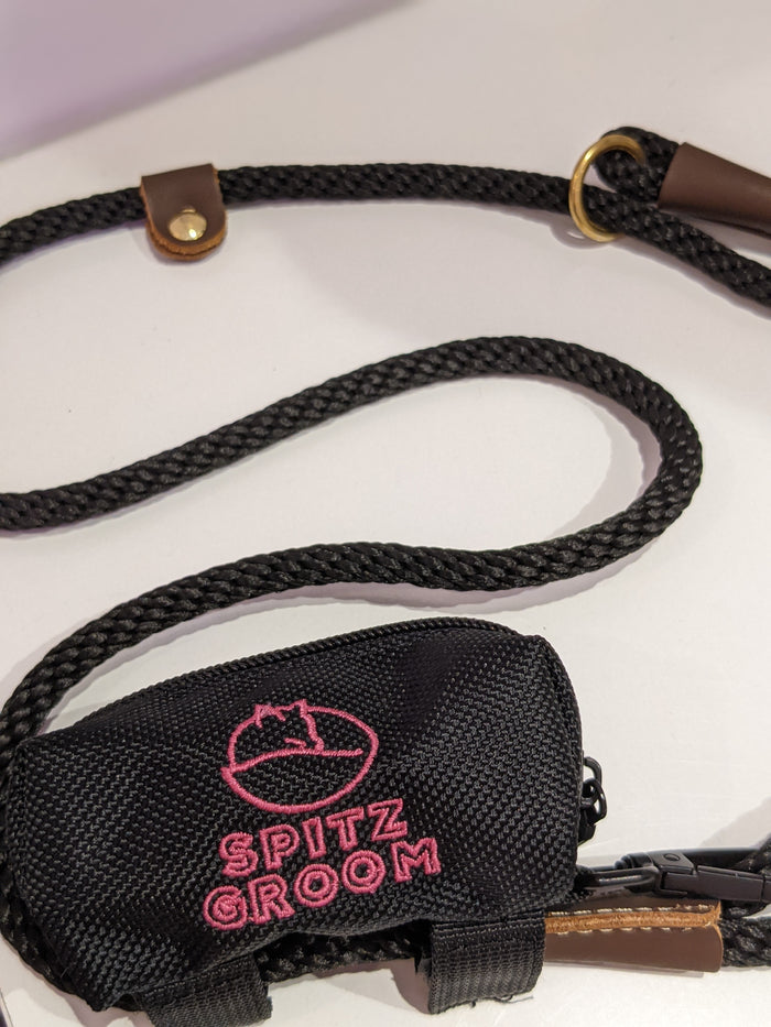 Black rope lead with brown leather trim attached to the Spitz Groom poo bag holder pouch