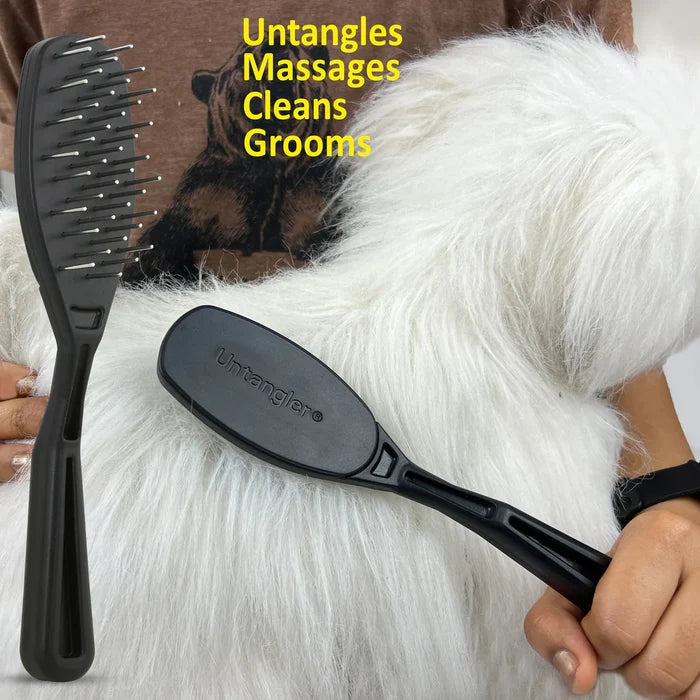 The Untangler PRO Brush being used on a fluffy white dog's coat