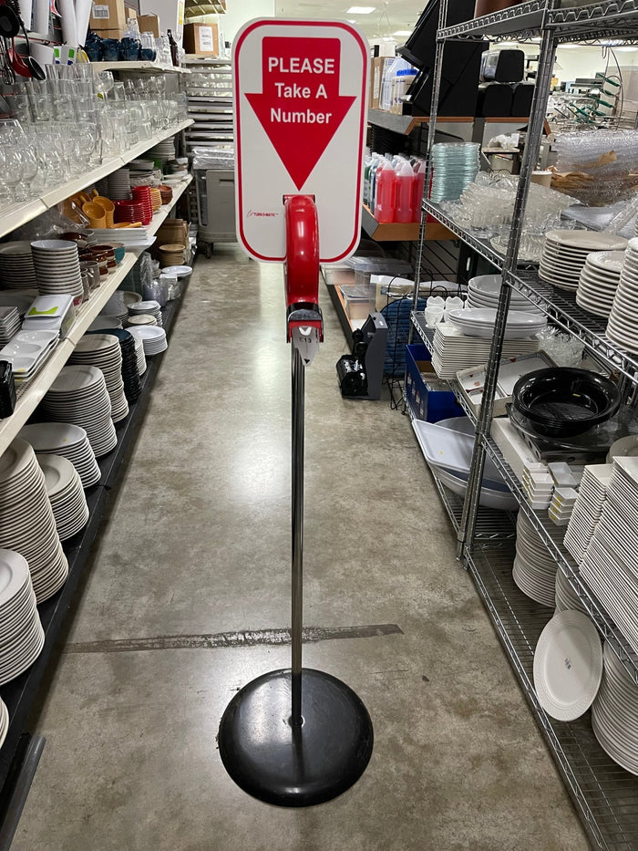 Used Microframe Turn - O - Matic Take A Number Ticket Dispenser with Floor Stand - Falcon Restaurant Supply - 1