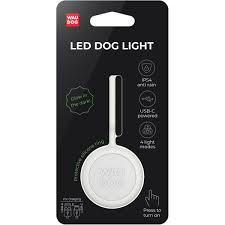 WauDog LED Dog Light packaging, white blister pack with product features
