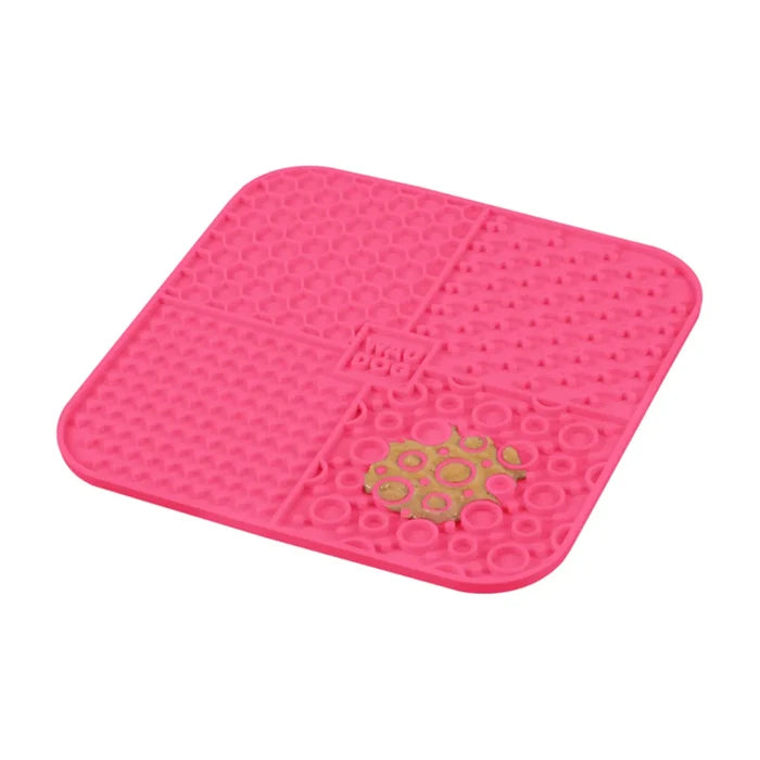 Pink Waudog silicone lick mat, angled view showing raised texture patterns